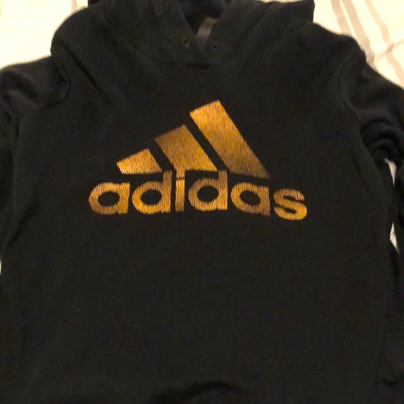 Black adidas hoodie with gold adidas logo very soft and comfortable. - Picture 1 of 3